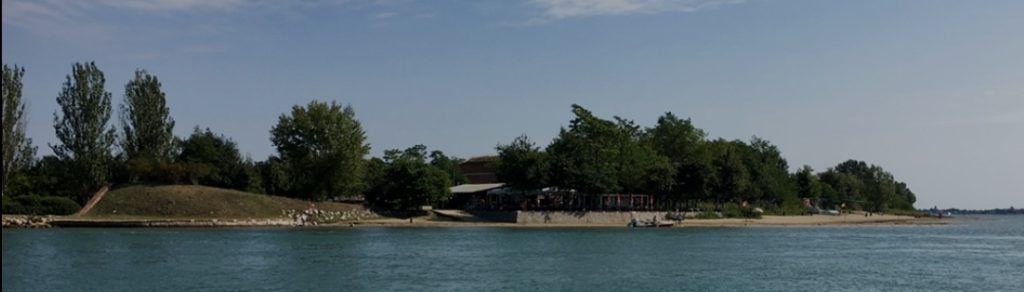 Torre Massimiliana fort and lagoon shoreline on SantāErasmo island, Venice.